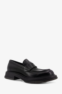 Black leather prada loafers with a glossy finish and chunky sole styled as gucci men’s leather loafers black