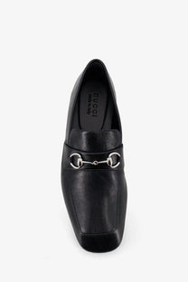 Black Gucci men’s leather Ragazzo loafer with smooth leather upper and polished silver horsebit hardware