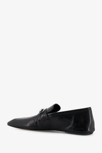 Gucci men’s black leather Ragazzo loafer with silver-toned metal buckle detail in front view