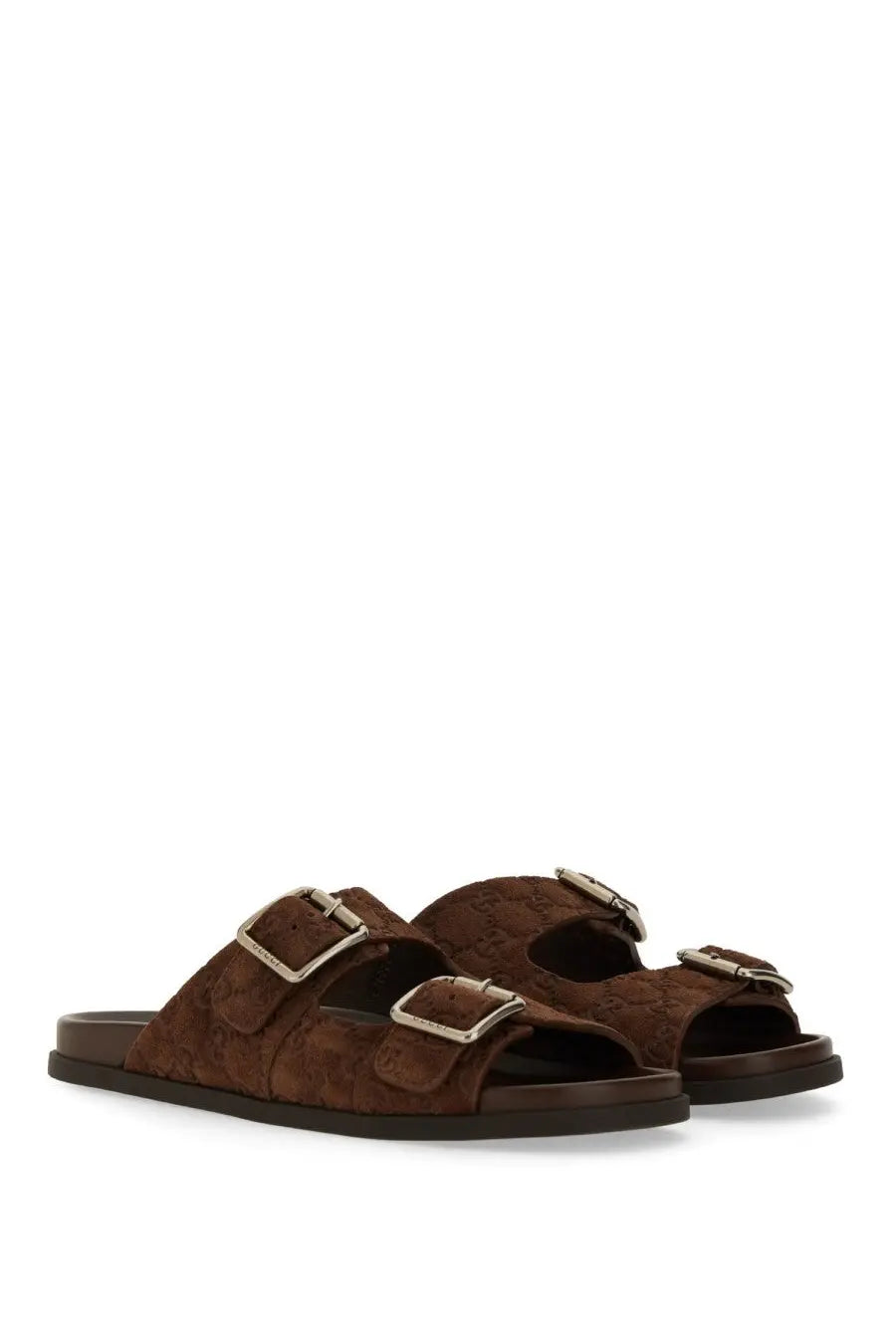 Gucci men’s brown leather slider sandal with silver buckle straps and subtle embossed logo pattern