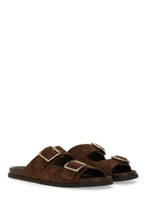 Gucci men’s brown leather slider sandal with silver buckle straps and subtle embossed logo pattern