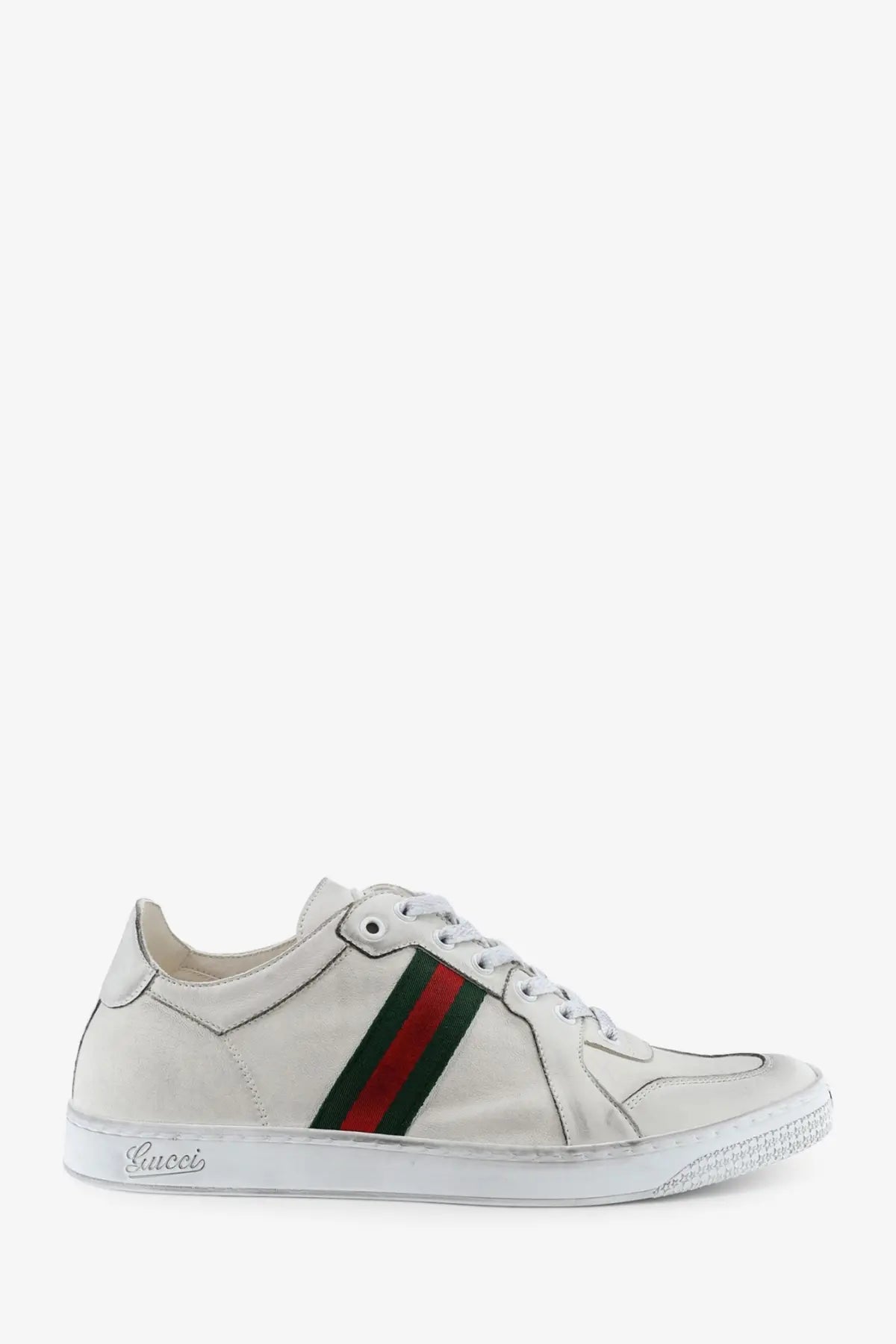 Gucci men’s white leather sneakers featuring a red and green striped band on the side