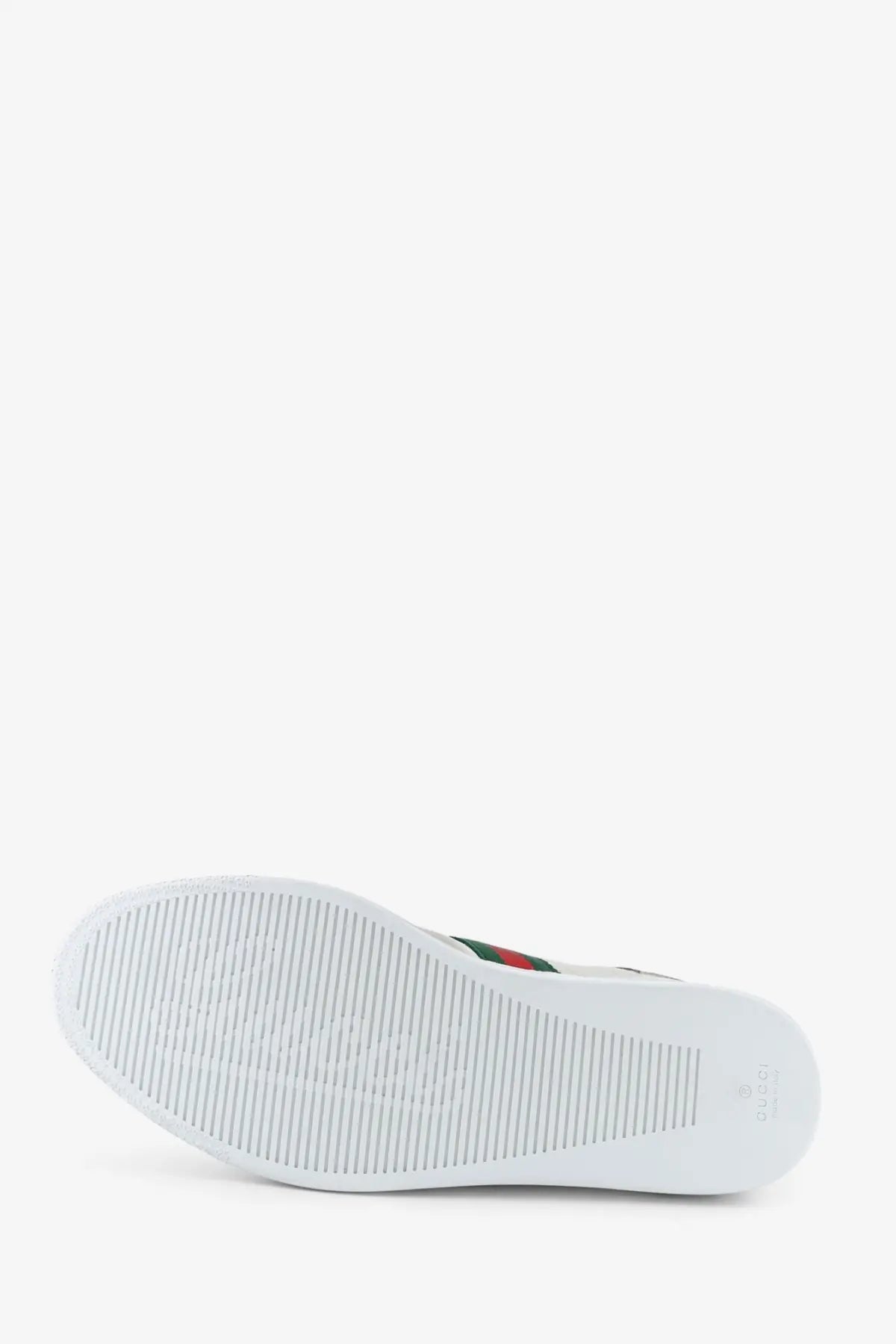 Gucci men’s leather white sneaker with textured rubber sole and signature green and red stripe on the side