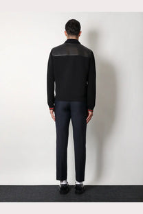 Gucci men’s black knit bomber jacket with contrasting leather shoulder panels and red-trimmed cuffs