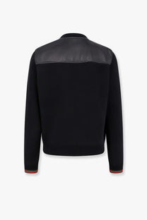 Gucci men’s black knit bomber jacket with contrasting matte leather shoulders and red green striped cuffs