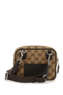 Gucci men’s mini GG bag in brown and beige GG supreme canvas with black leather accents crossbody style