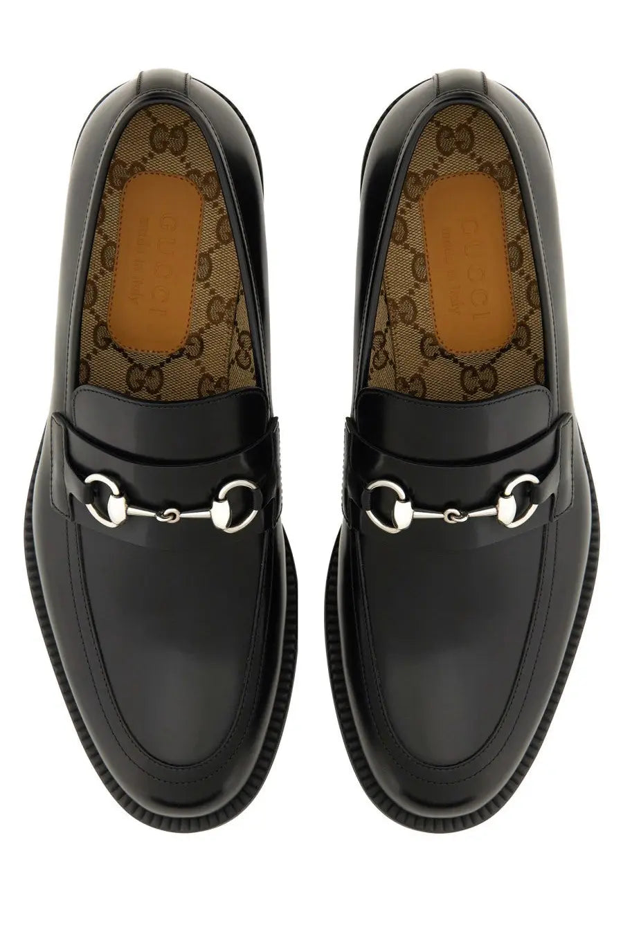 Black gucci men’s moccasin loafers in glossy leather with silver toned horsebit metal accents