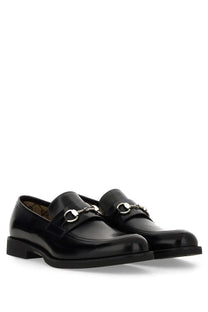 Black leather Gucci men’s moccasin loafers with silver horsebit detailing