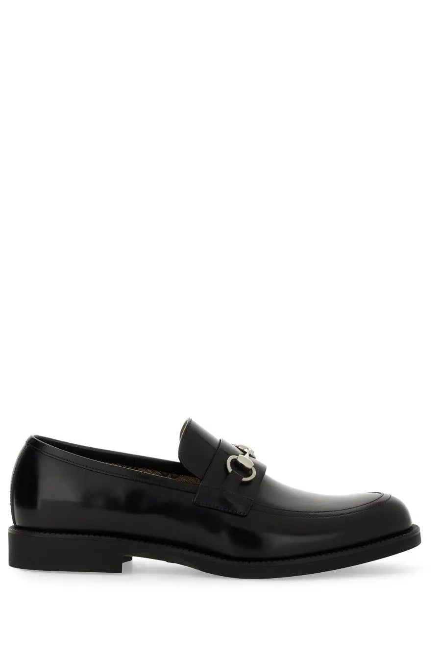 Gucci men’s moccasin black patent leather loafer with silver horsebit buckle visible from the front side