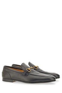 Black leather gucci men’s moccasin jordaan loafers with gold-tone horsebit detailing for stylish wear