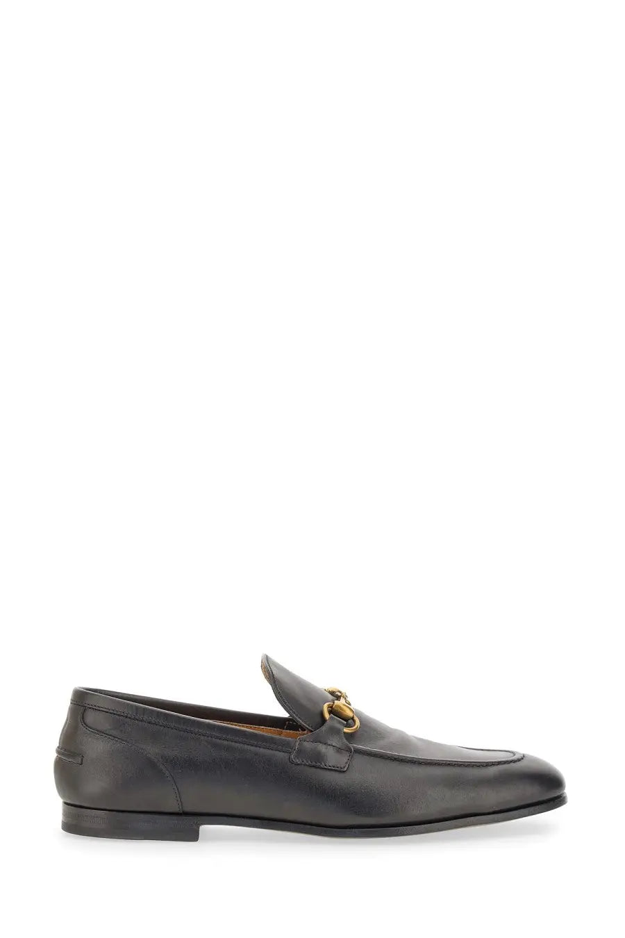Black leather Gucci men’s moccasin Jordaan loafers with gold tone horsebit buckle for stylish wear