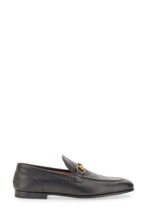 Black leather Gucci men’s moccasin Jordaan loafers with gold tone horsebit buckle for stylish wear