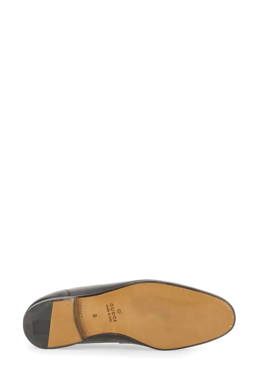 Back view of gucci men’s moccasin jordaan black dress shoe with tan leather sole and embossed branding on heel