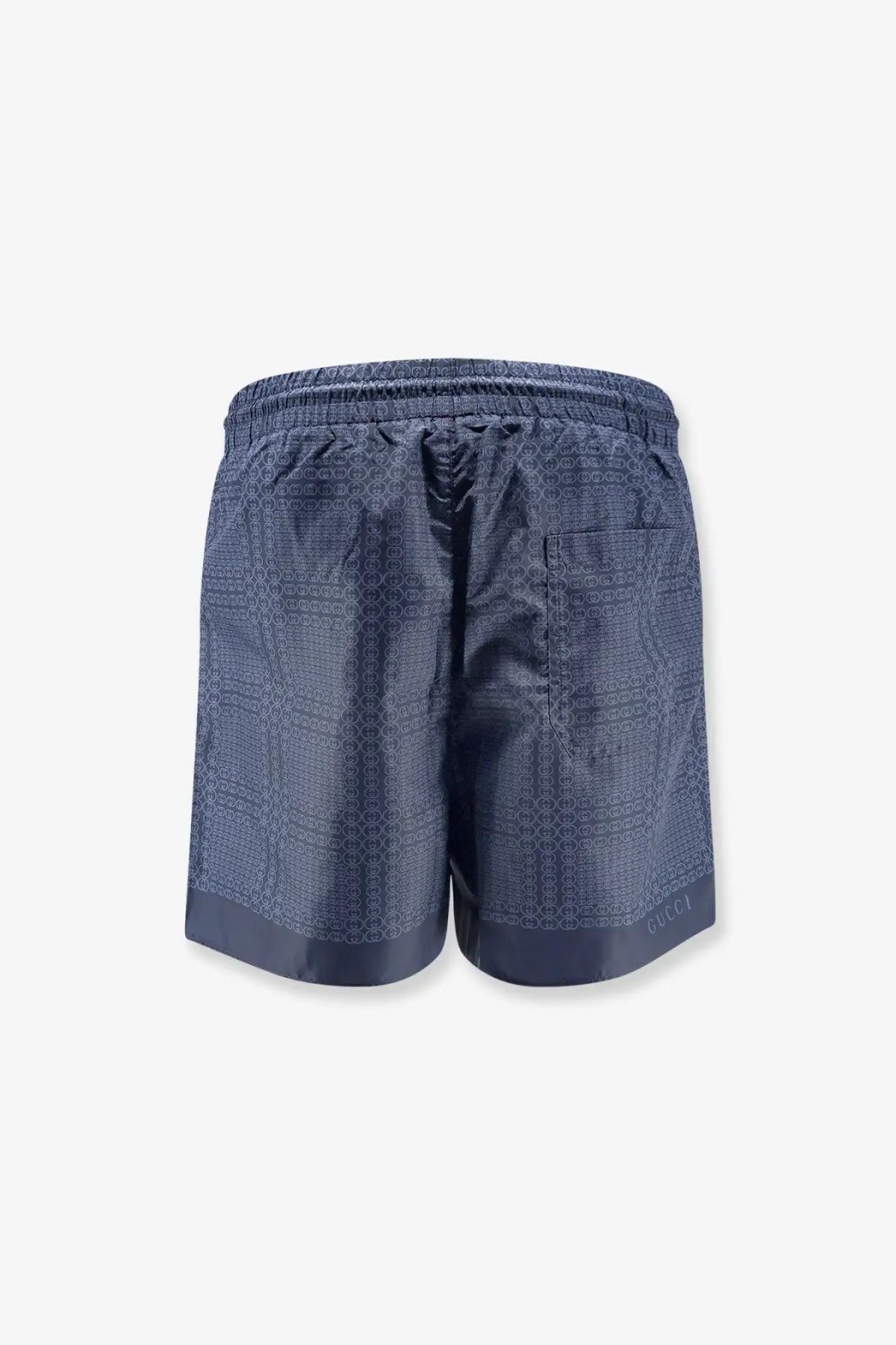 Gucci men’s dark blue nylon swim trunks with subtle geometric pattern and elastic waistband for comfortable wear