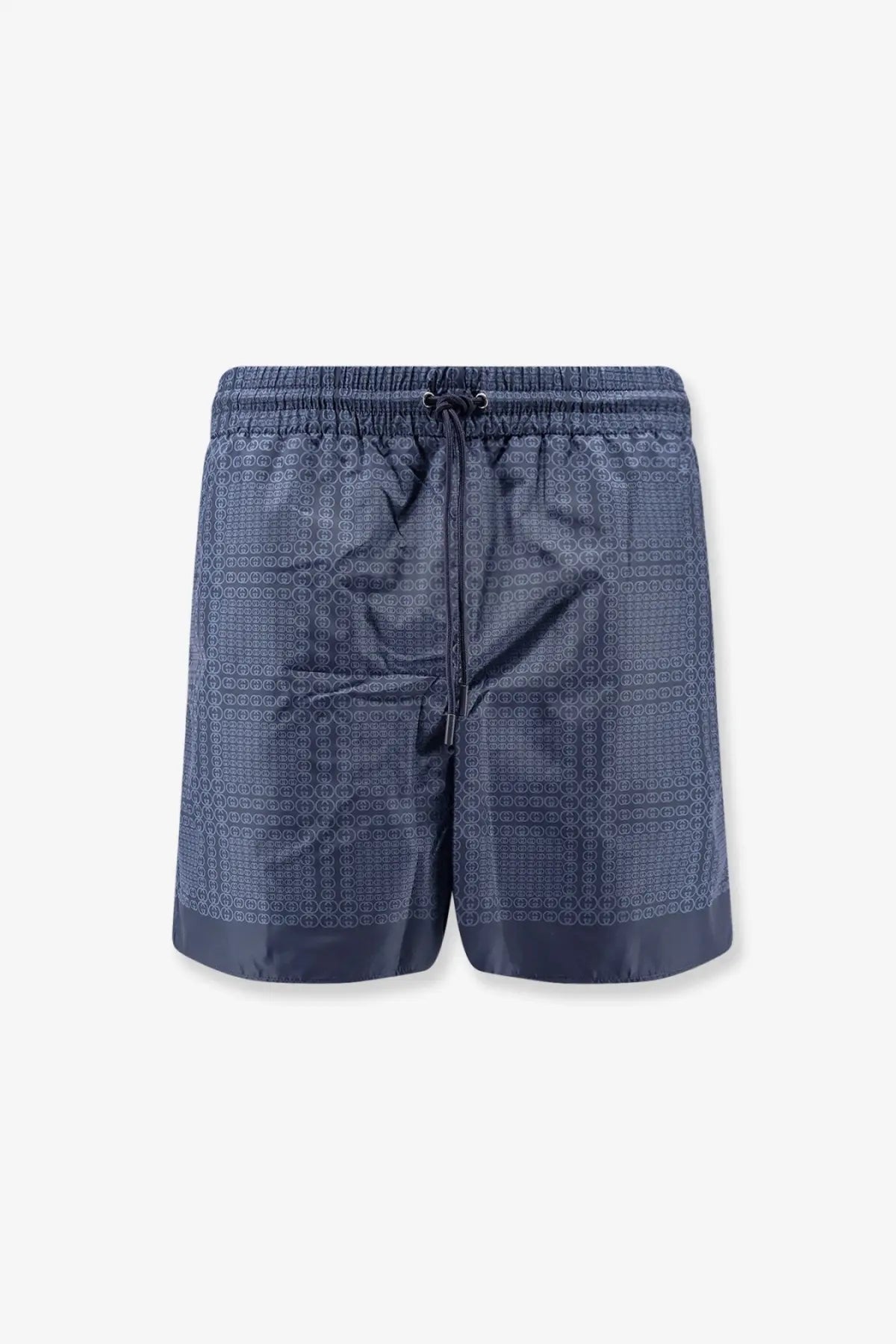 Gucci men’s nylon swim trunks in dark blue with a subtle geometric pattern and matching drawstring waistband
