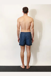 Navy blue Gucci men’s nylon swim trunks with a subtle textured pattern for stylish beachwear