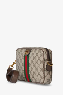 Beige and brown gucci men’s ophidia gg supreme fabric crossbody bag with red and green stripe and gold hardware