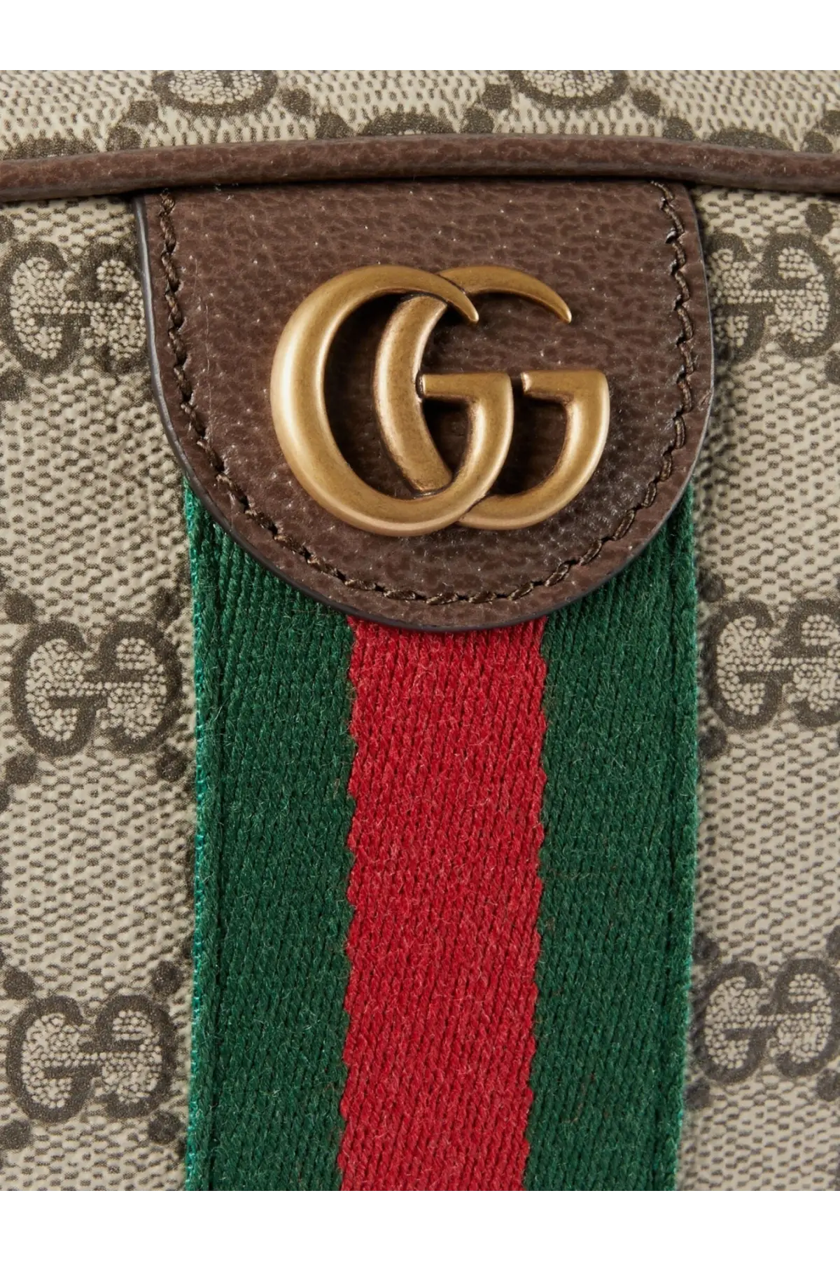 Brown leather patch with gold-tone interlocking gg logo on beige canvas gucci men’s ophidia gg supreme fabric shoulder bag