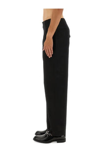 Gucci men’s black tailored trousers with a sleek straight-leg cut and subtle side pockets