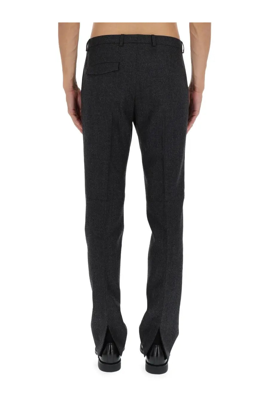 Gucci men’s wool trousers in black with textured fabric straight-leg cut and split cuffs front view