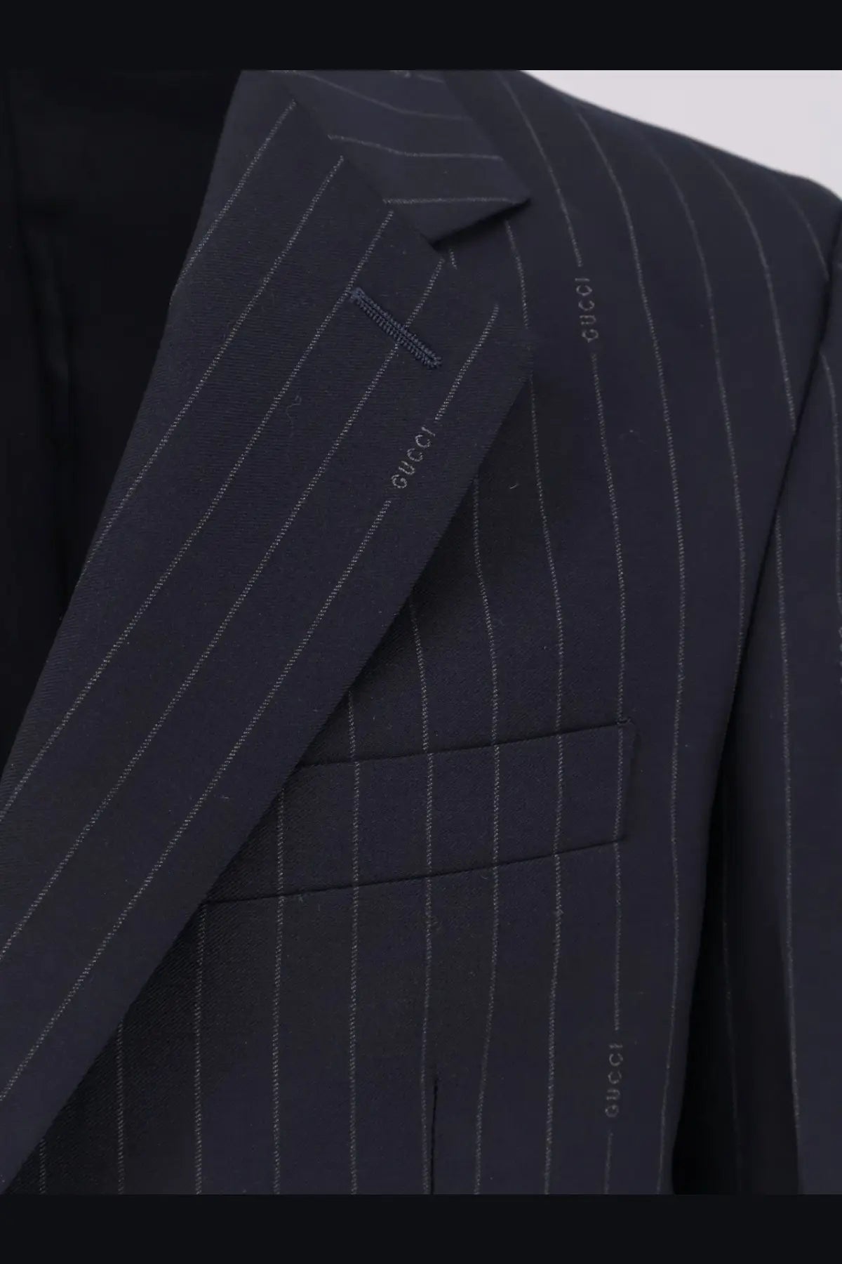 Gucci men’s dark navy pinstripe wool single breasted blazer with subtle silver thread detailing and embroidered branding