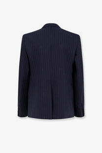 Navy blue pinstripe wool single breasted blazer with fine vertical stripes and subtle textured detailing by Gucci