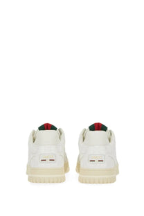 White gucci men’s re web sneaker with cream rubber sole and red and green striped fabric at the heel back side