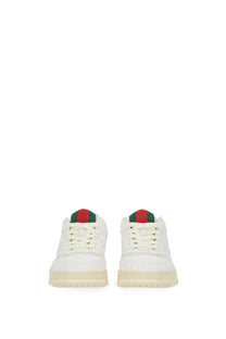 White gucci men’s re web sneaker with leather upper and red green striped accents on the tongue