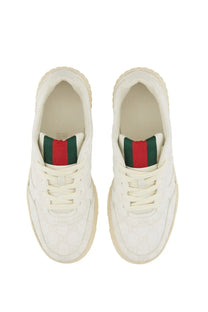 Gucci men’s RE web sneaker white with subtle textured upper cream rubber sole and red green striped collar lining