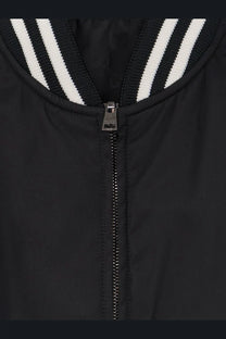 Gucci men’s reversible black bomber jacket with silver zipper and white-striped ribbed collar in nylon material