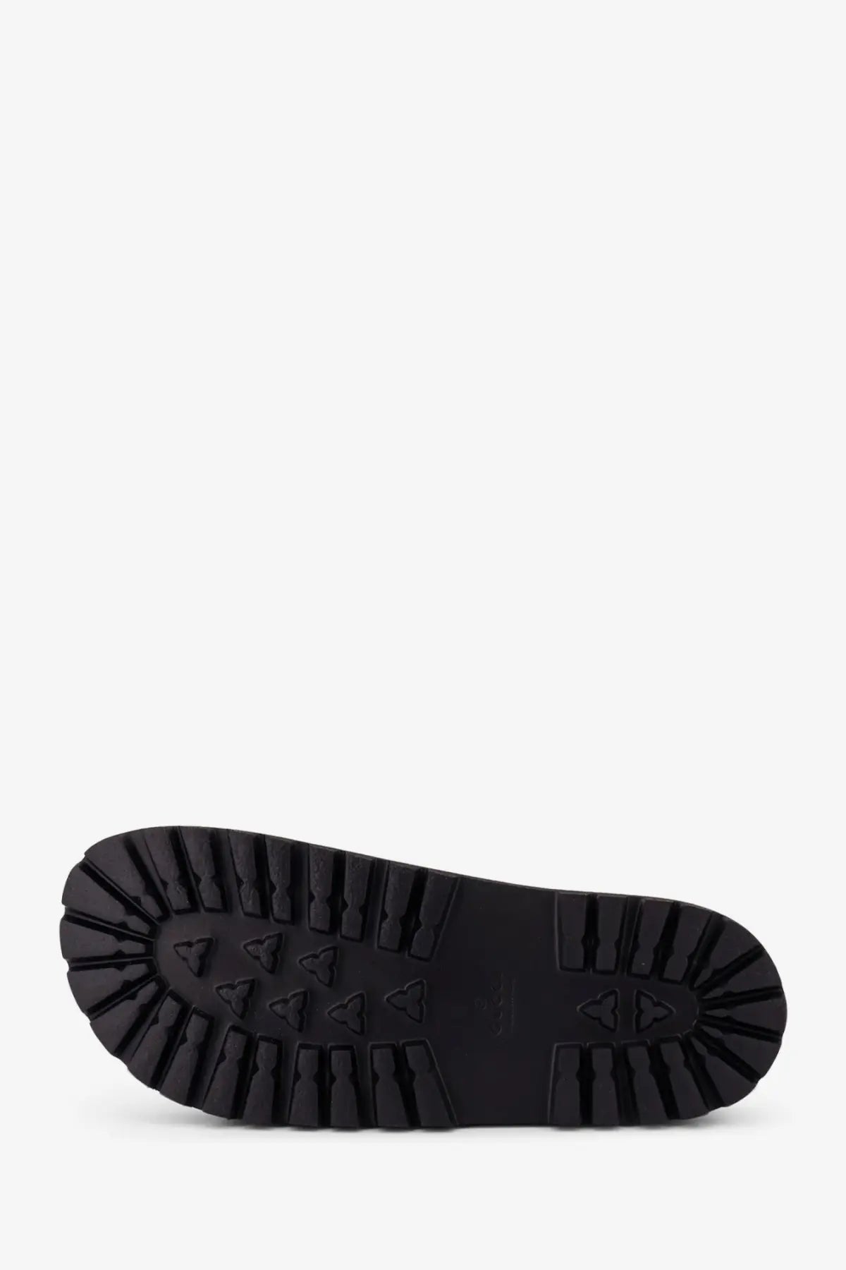 Black rubber sole of gucci men’s rubber slide with deep textured tread and triangular grip markings visible from back side