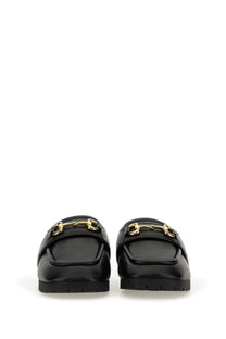 Black leather Gucci men’s sabot loafers with gold-tone horsebit buckles