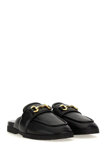 Gucci men’s sabot black leather mules with gold tone horsebit detailing front view