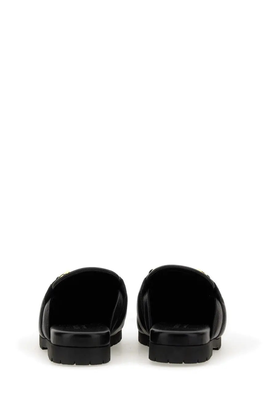 Gucci men’s sabot black leather slide sandals with chunky sole and subtle metallic detailing on the strap