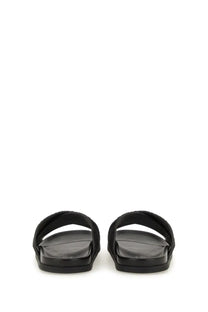 Gucci men’s black leather slide sandals with braided strap design for casual wear