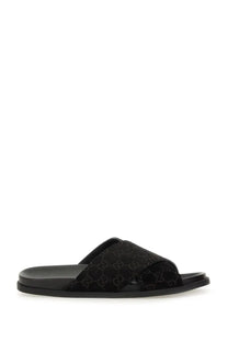 Gucci men’s black slide sandal with velvet upper featuring tonal gg logo and sleek rubber sole for casual wear