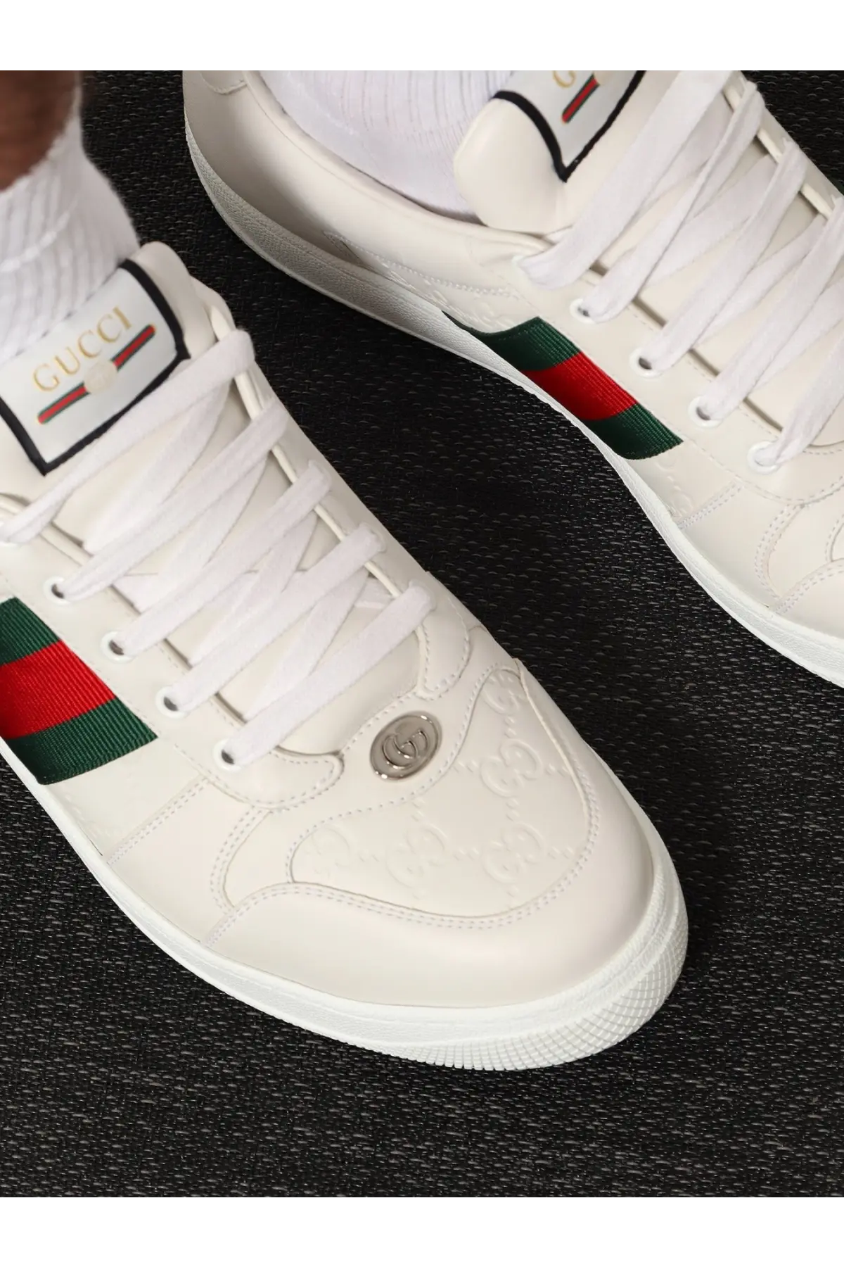 Gucci men’s screener leather sneakers white with sleek leather upper and red green striped side accents