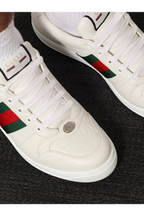Gucci men’s screener leather sneakers white with sleek leather upper and red green striped side accents