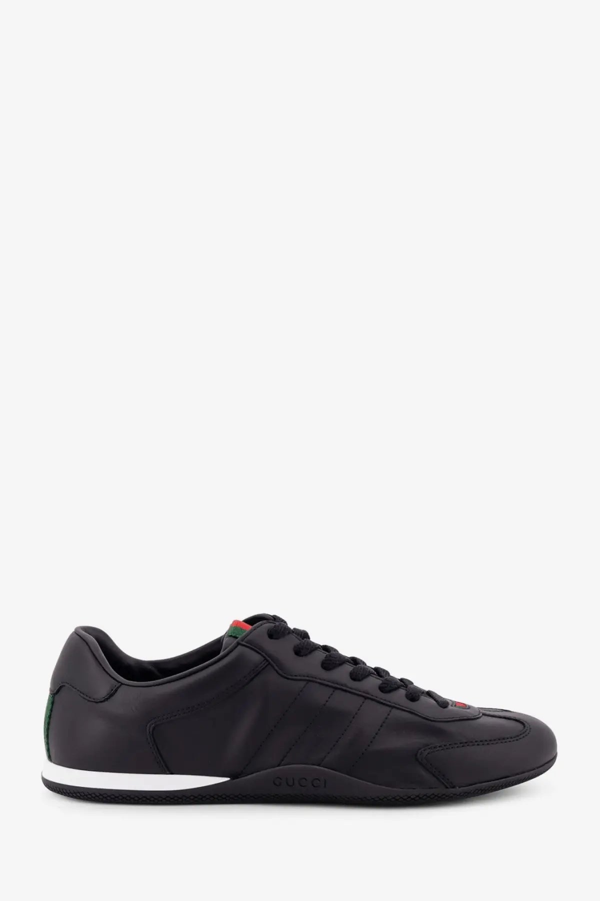Black gucci men’s shift leather sneakers with sleek upper and green red details on heel tab and tongue