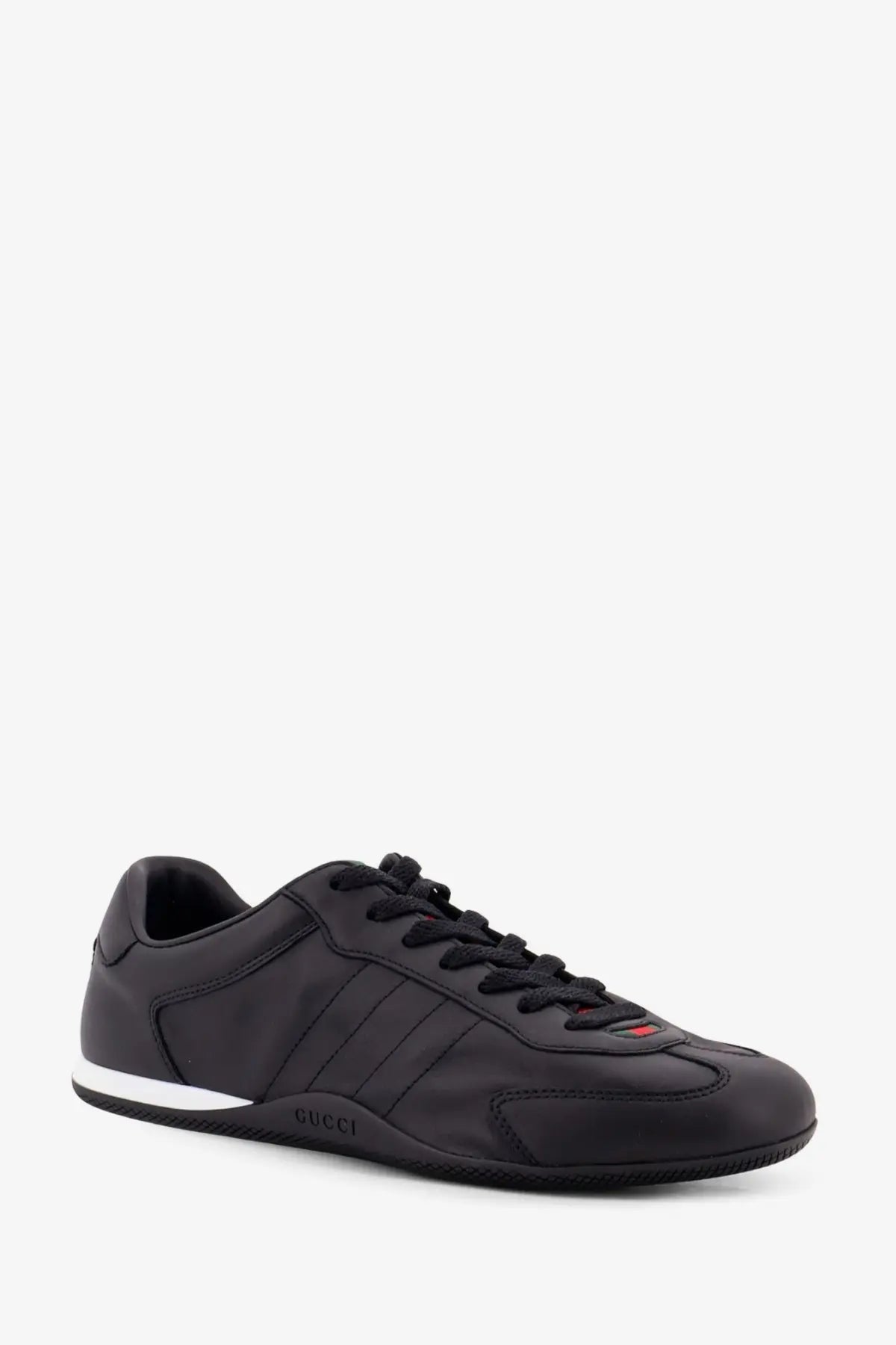 Black Gucci men’s Gucci shift leather sneaker with sleek leather upper white rubber sole and red accent on tongue