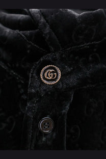 Gucci men’s black stretch velvet jacket with gold-tone Gucci double g logo button enhancing luxury style