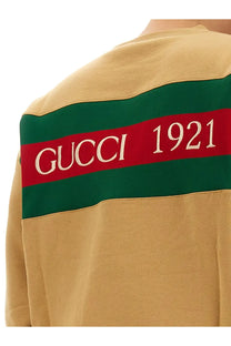 Beige gucci men’s sweatshirt with bold green and red striped band embroidered with gucci 1921 in white