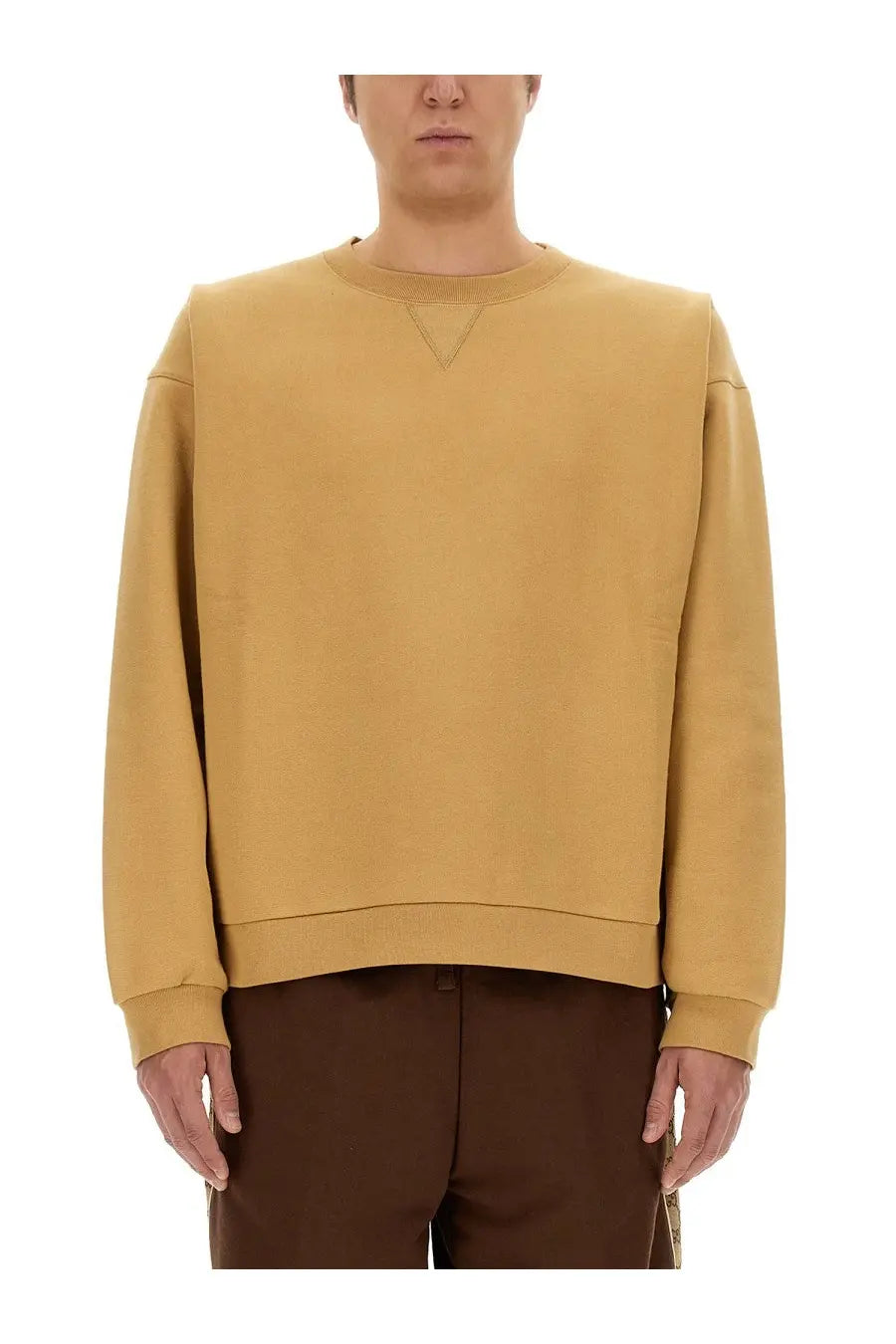Gucci men’s mustard yellow oversized crewneck sweatshirt with subtle triangular seam detail at the neckline