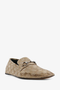 Beige Gucci men’s vintage effect GG fabric loafers with repeating monogram pattern and silver horsebit detailing