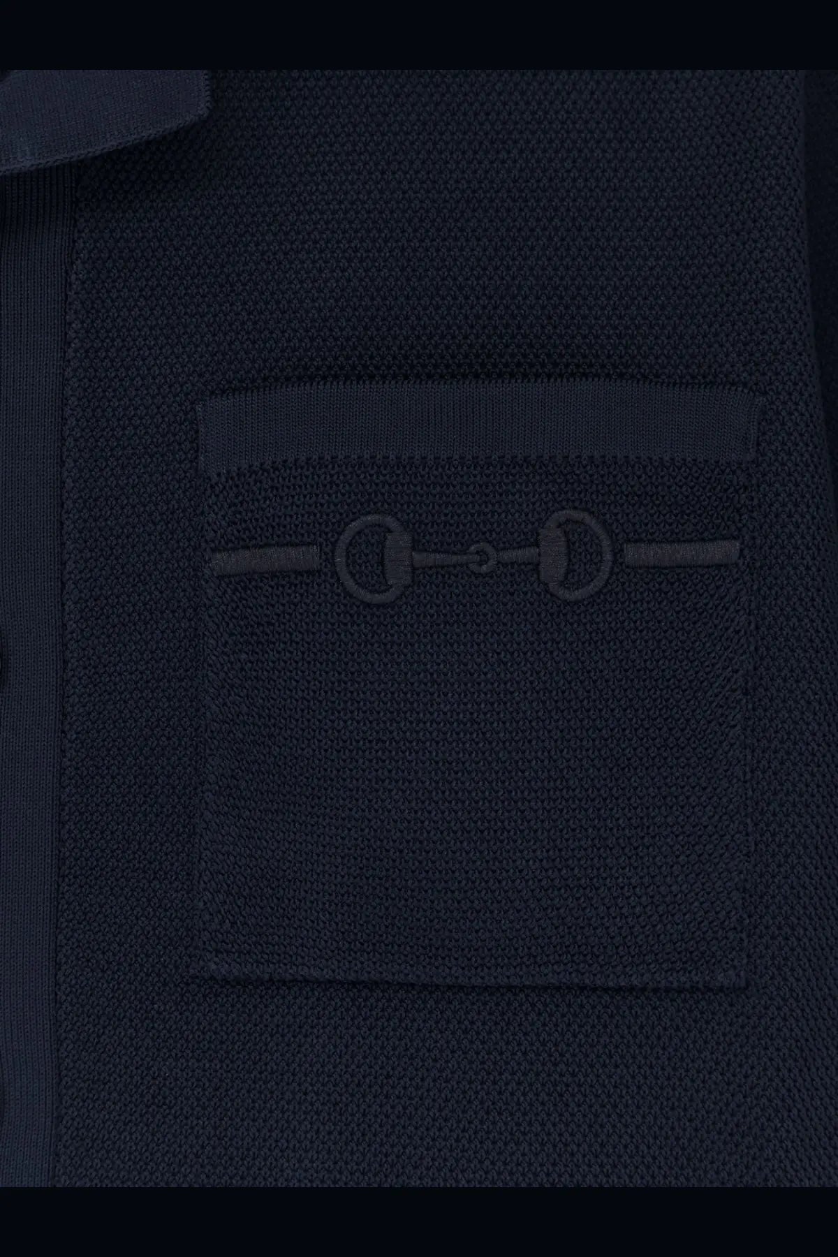 Dark navy knit jacket with subtle horsebit detail on chest pocket paired with gucci mens viscose blend polo shirt blue