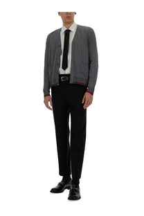 Gray textured cardigan with red trim worn over white shirt and black tie in gucci mens web pattern cardigan blue