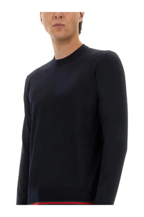 Black Gucci men’s long-sleeved ribbed sweater with crew neckline and red trim along hem in web pattern style