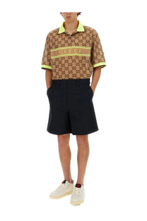 Beige gucci polo shirt with repeating gg logo pattern and neon yellow trim paired with gucci mens web ribbon shorts blue