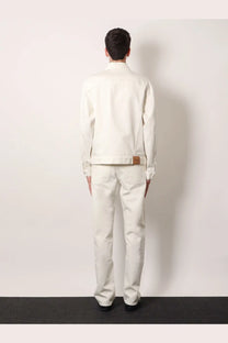 Gucci men’s white denim jacket with a crisp white finish and subtle brown leather patch at the waistband