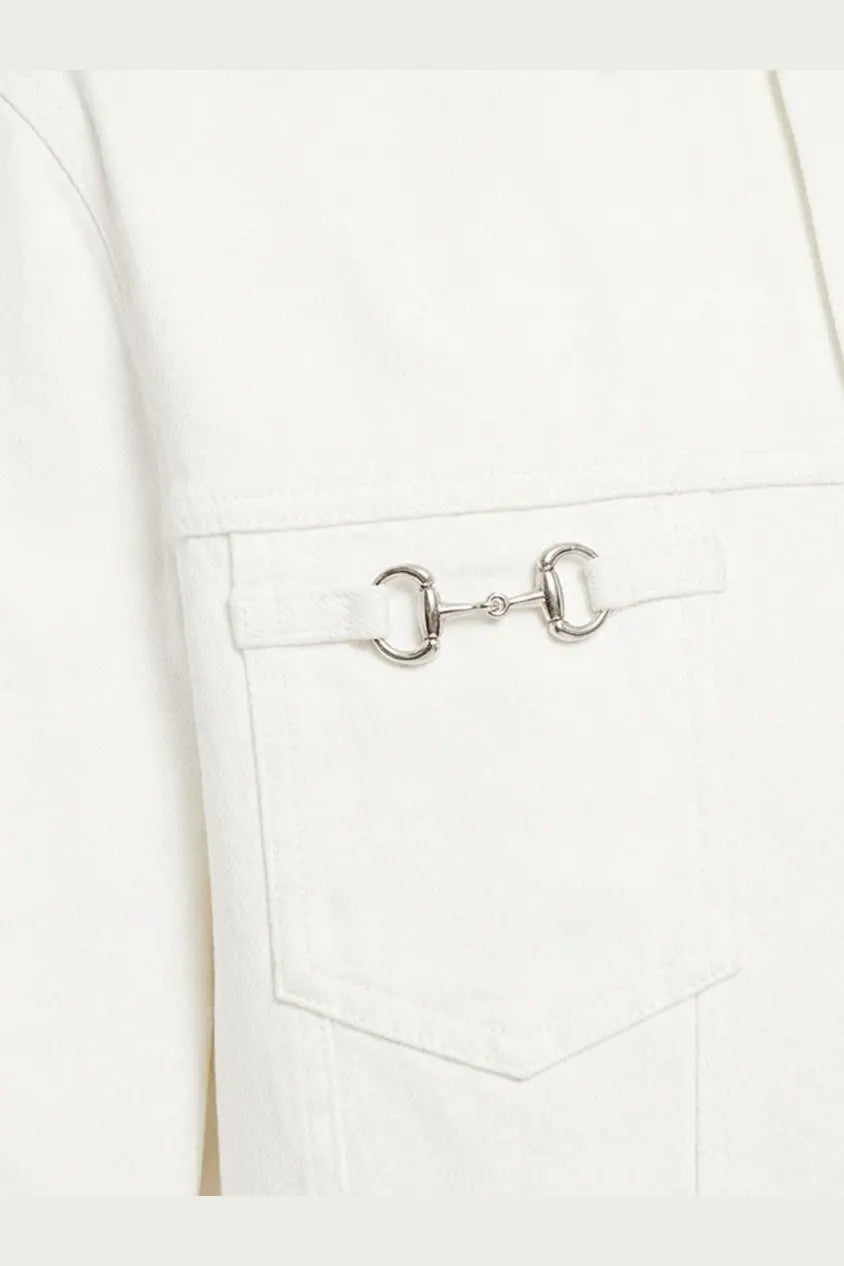 Silver horsebit buckle detail on Gucci men’s white denim jacket pocket in white material